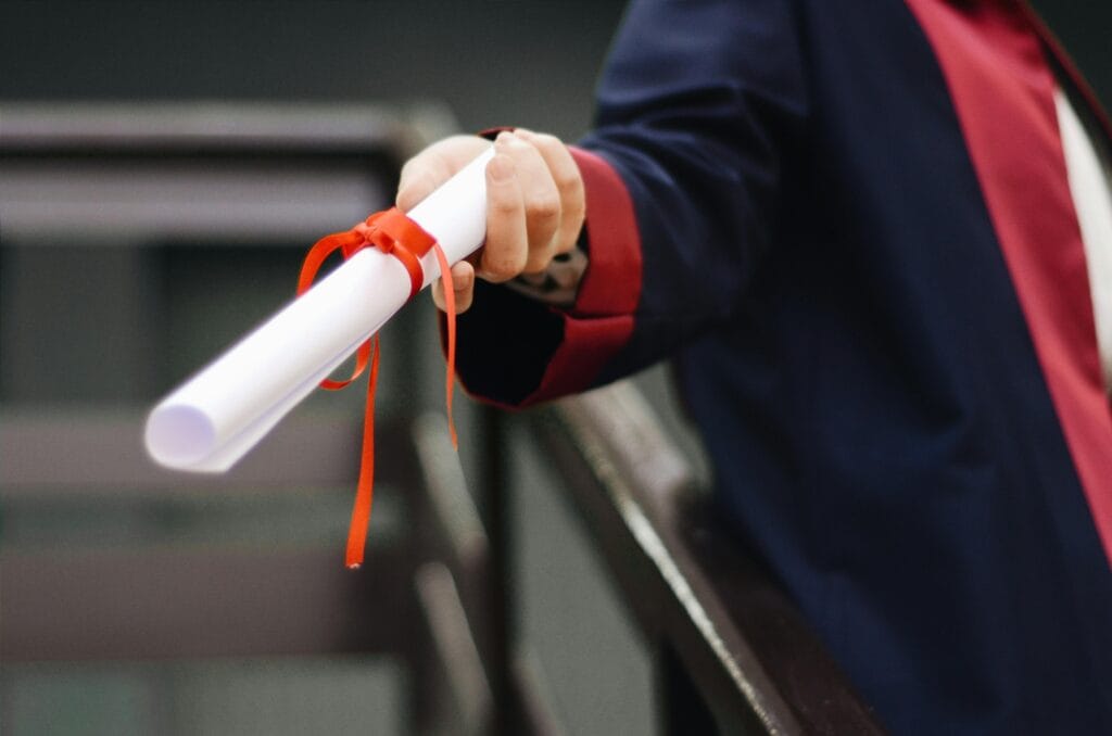 pexels-photo-2292837-2292837 Person Holding White Scroll